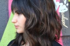 05 a medium length haircut with bangs and much dimension is a modenr option