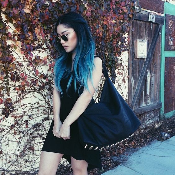 a gorgeous rock-inspired long layered haircut with black to turquoise ombre