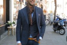 10 blue denim, a blue shirt, a blazer plus a waistcoat and a brown printed scarf for a touch of chic