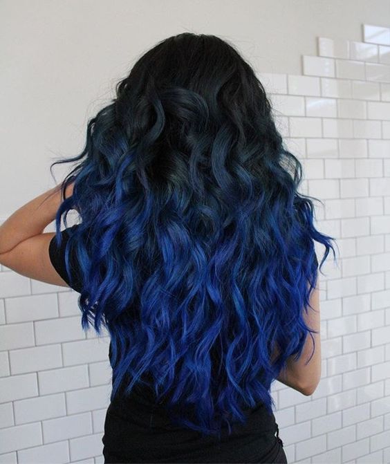 bold thick hair with ombre from black to bright blue and lots of waves to impress
