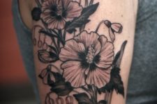 Big floral tattoo on the arm