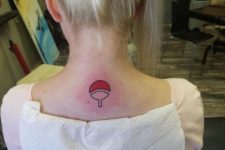 Black and red tennis racket tattoo