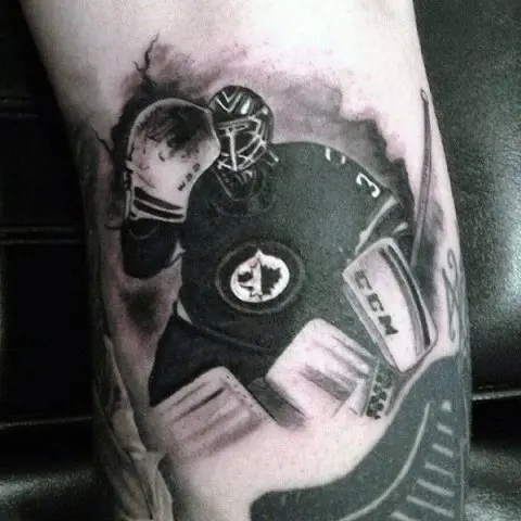 Black and white hockey player tattoo