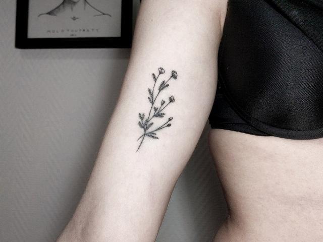 Black bluebell flower tattoo on the hand