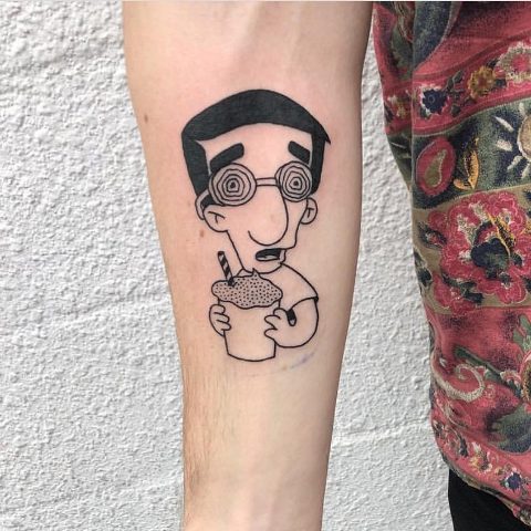 Black-contour Milhouse tattoo on the arm