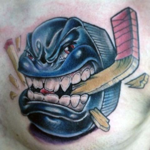 Cartoon hockey puck tattoo