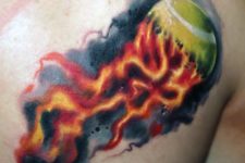 Fire and tennis ball tattoo on the chest