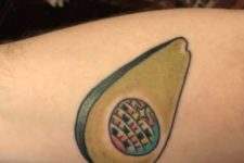 Funny disco ball in avocado tattoo