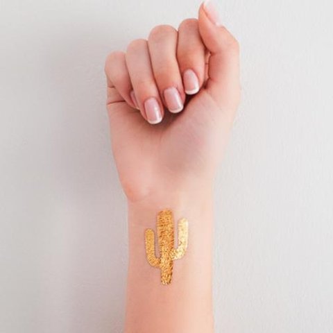 Golden tattoo on the wrist