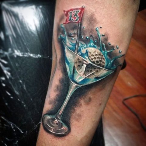 Golf ball in glass tattoo