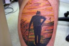 Golf player and sunset tattoo on the leg