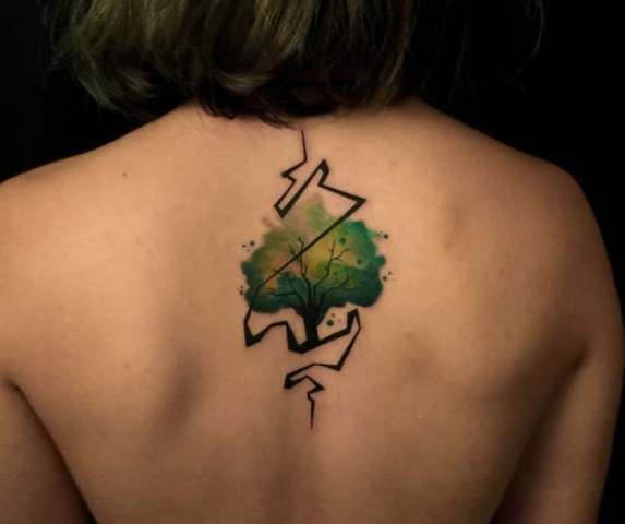Green tattoo on the back