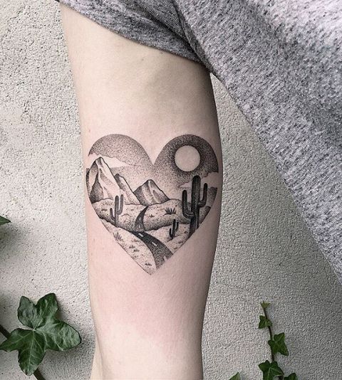 Heart shaped tattoo on the arm