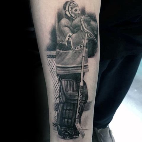 Hockey player tattoo on the arm