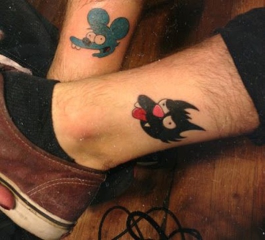 Itchy and Scratchy tattoos on the legs