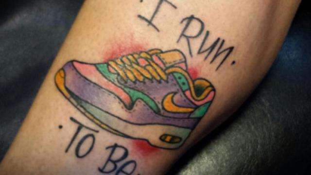 Colorful sneakers tattoo on the leg