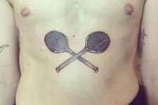 Tennis rackets tattoo on the stomach
