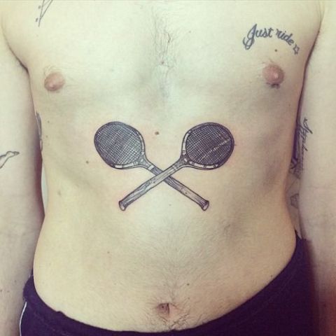 Tennis rackets tattoo on the stomach
