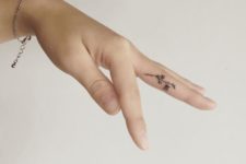 Tiny tattoo on the finger