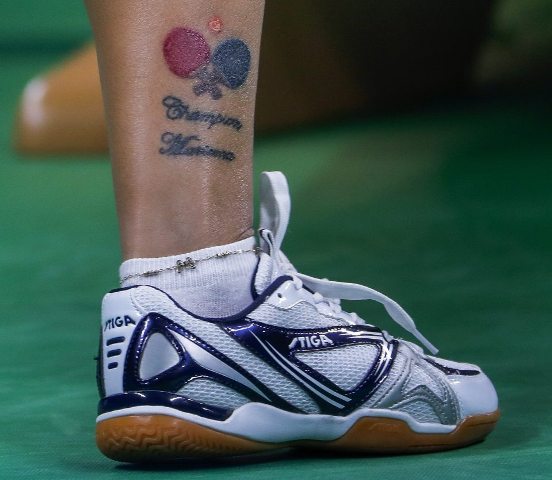 Two rackets tattoo on the ankle