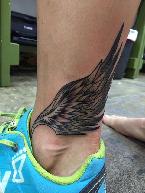 Wing tattoo on the ankle