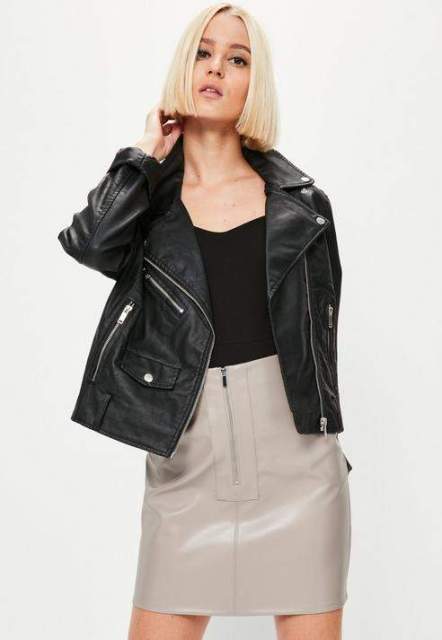 With black top and leather jacket