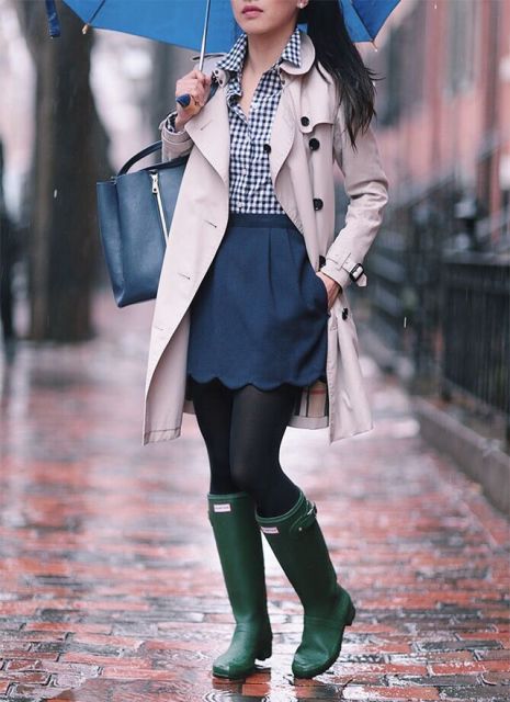 With checked shirt, beige trench coat, navy blue tote and green high boots