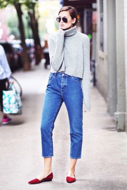 With cropped jeans and red flats
