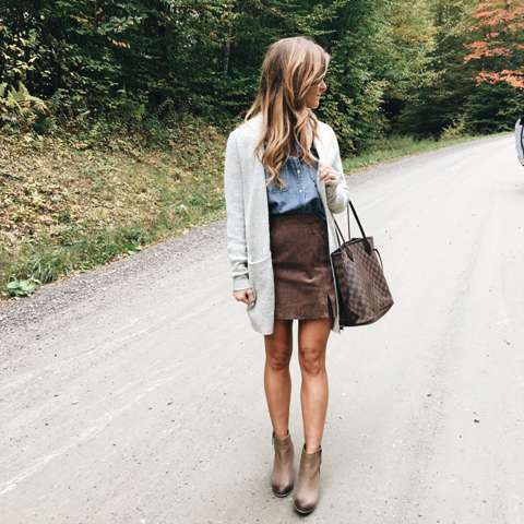 With denim shirt, white cardigan, ankle boots and printed tote