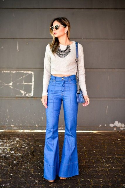 With flare jeans, necklace, chain strap bag and boots