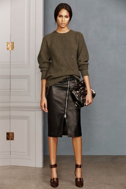 With olive green loose sweater, ankle strap shoes and clutch