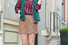 With plaid button down shirt, vest and brown leather boots