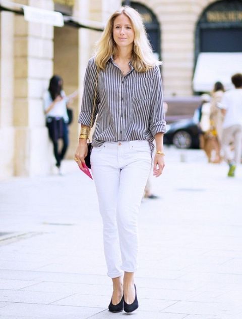 With striped shirt, white pants and chain strap bag