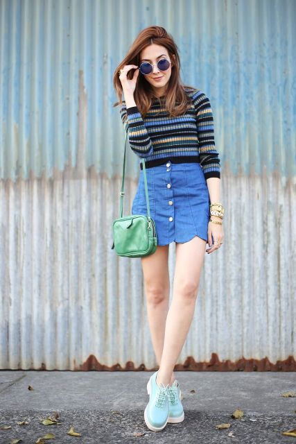 With striped sweater, green bag and light blue sneakers