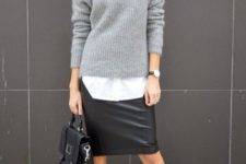 With white shirt, gray sweater, black bag and lace up boots