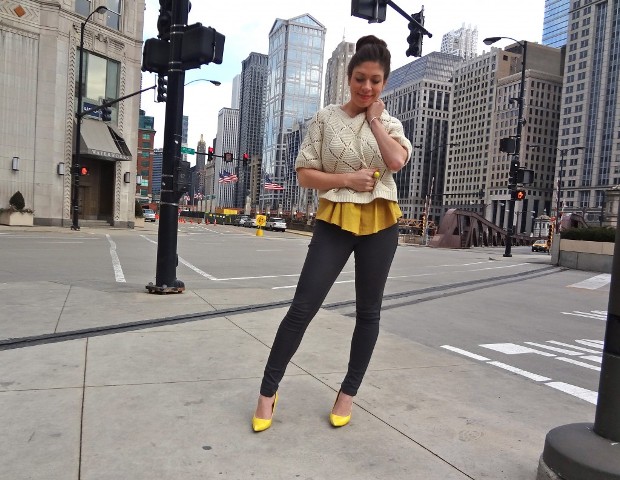 With yellow blouse, skinny pants and yellow pumps