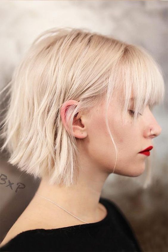 A beautiful midi platinum bob with a classic fringe and a lot of volume is a super cool and eye catching idea