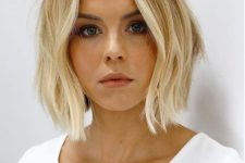 a blonde bob with a warmer shade on top and bleached ombre plus messy waves is a very effortless idea