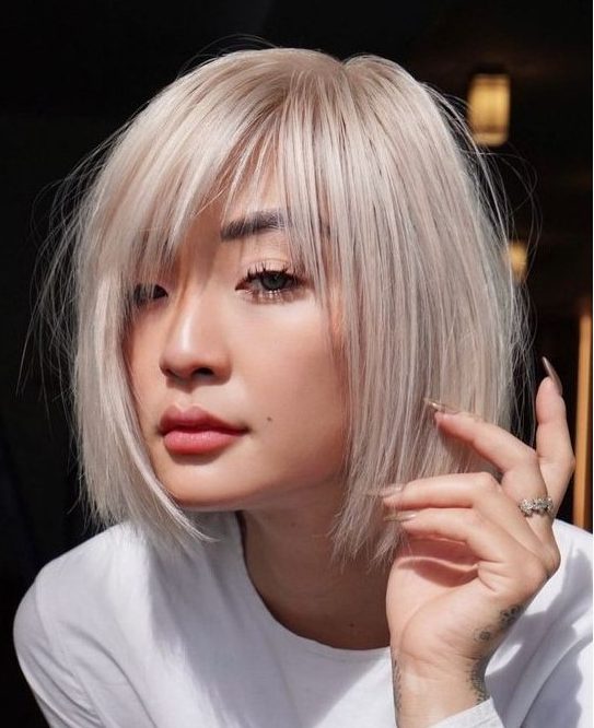 A chin length platinum blonde bob with wispy bangs and side parting is a classyc and very airy looking solution