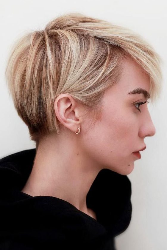 a long pixie with warm blonde balayage and textured hair plus a lot of volume is adorable