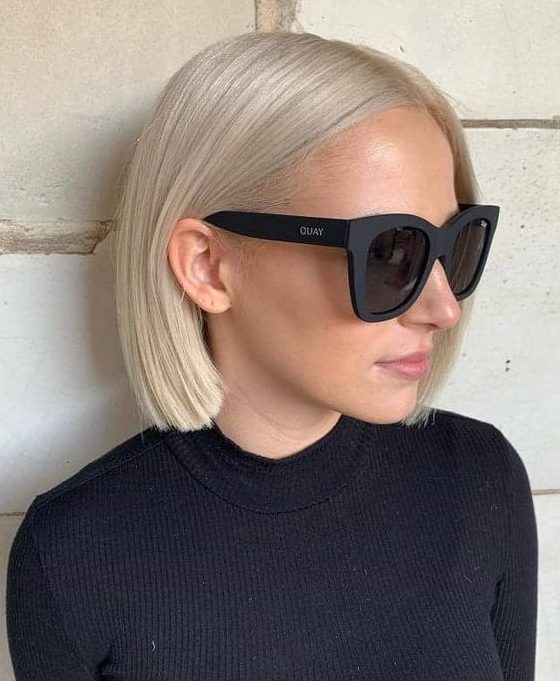a midi platinum blonde bob with straight hair is a stylish and chic idea to rock, it's pure classics