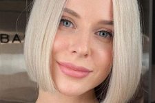 a perfect chin-length platinum blonde bob with middle part and straight hair with a bit of curled ends is a cool idea