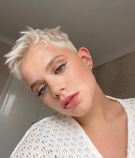 a short and textural platinum blonde pixie is a cool and very up-to-date solution