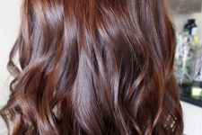 beautiful long auburn hair with waves and volume, with a shiny finish, is a catchy and cool solution
