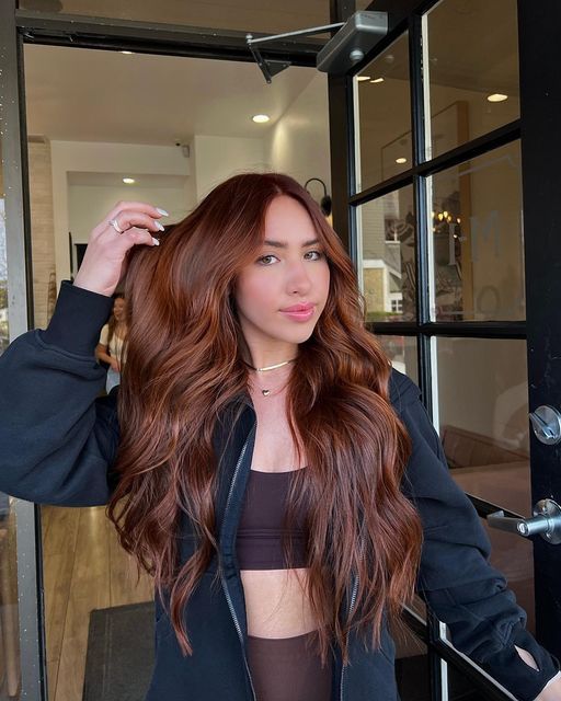 fabulous long auburn hair with a lot of volume and waves is a stylish and chic idea, it strikes both with color and volume