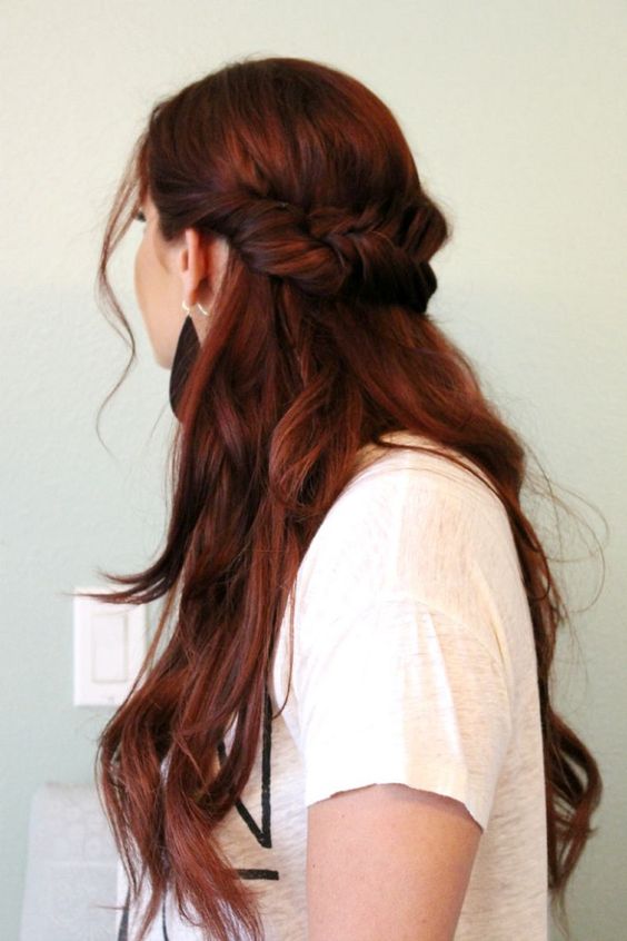 fantastic long auburn hair styled as a half updo, with a braided part and long wavy hair down