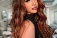 gorgeous long auburn hair with ginger highlights, volume and waves, is a very bold and cool solution