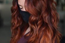 jaw-dropping long auburn hair, with a slight ombre effect, volume and waves, is a fantastic idea that will make you stand out a lot