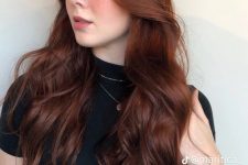 long and volumetric auburn hair with a slight ombre effect, with waves, is a lovely idea with plenty of color