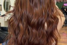 long auburn hair with waves and a lot of volume is a catchy and cool idea, it looks bold, cool and chic